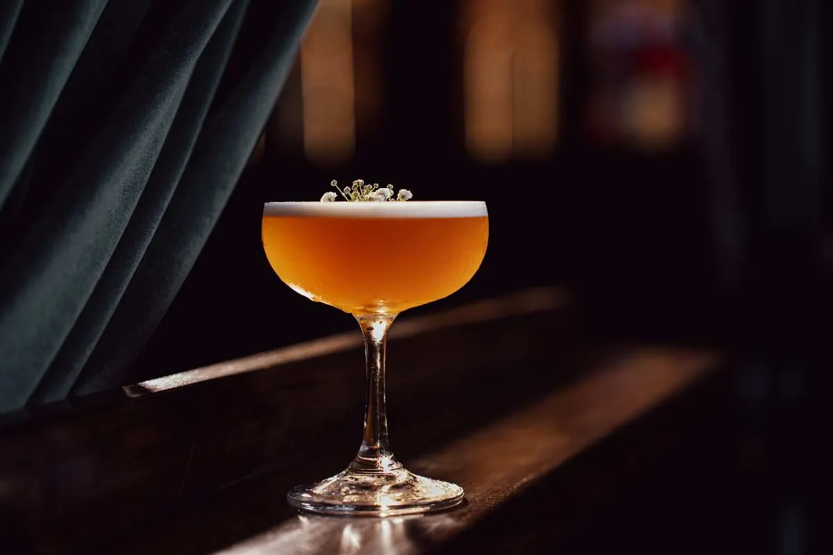 Borderwalls coupe with floral garnish