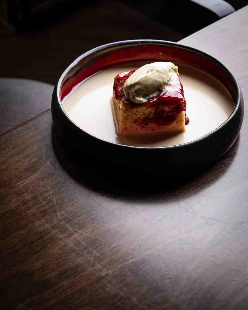 Tres leches with strawberry compote